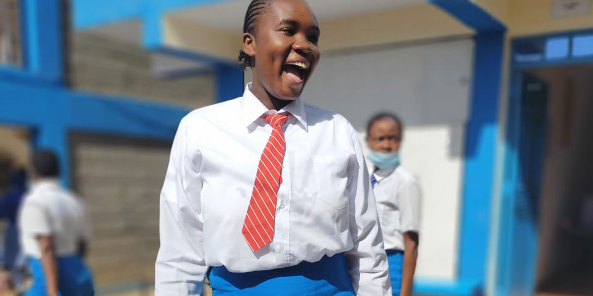 Scholarship student, Faith is overjoyed to celebrate the official opening day!